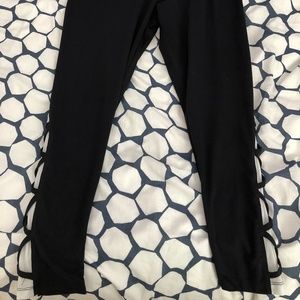 Black leggings with a mesh panel on leg